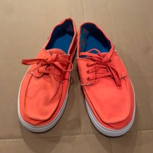 Bright orange Sanuk shoes for men